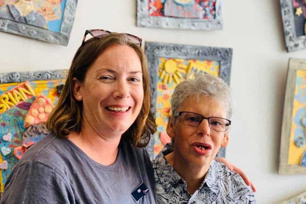 Ability Art's Elli with customer and artist, Brian