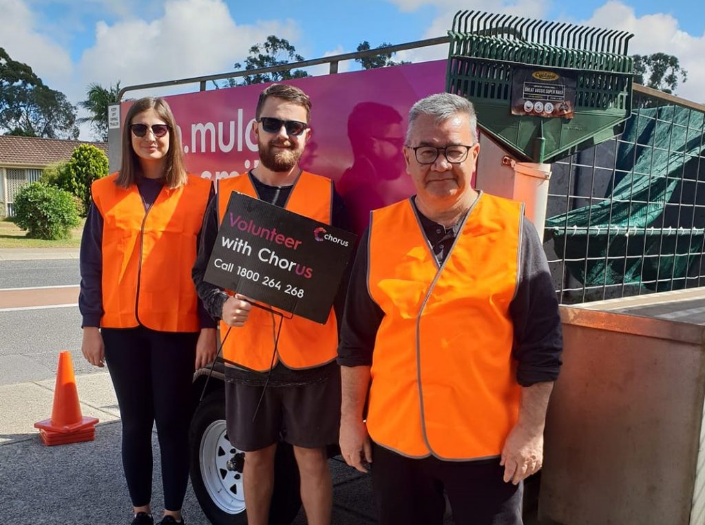 Gardening volunteers outside a customers home