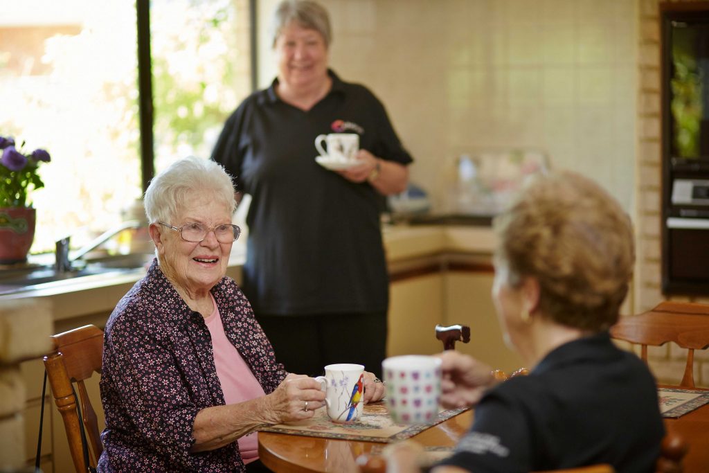 Older Person Talking with Chorus Staff