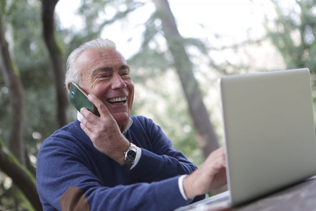 a-man-in-wearing-long-sleeve-shirt-using-digital-gadgets