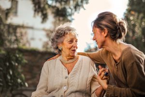 Woman talking to mother about aged care