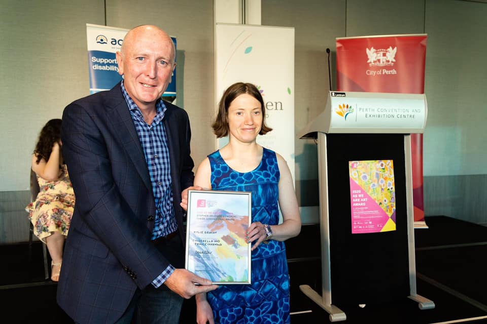 Minister for Disability Services, Stephen Dawson, presents Kylie Graham with her award